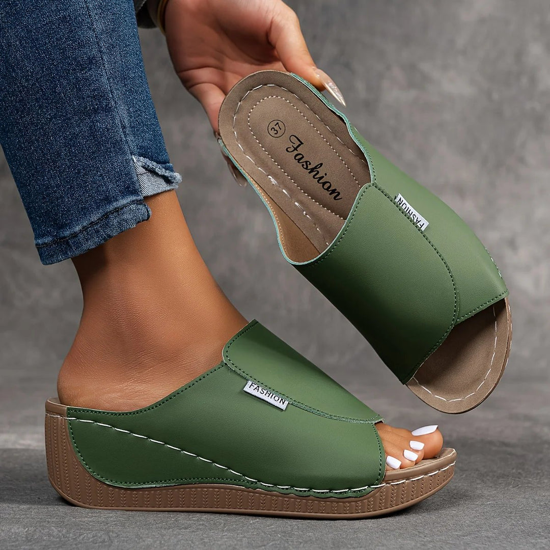 Amelia | Arch-Support Cushioned Wedge SandalHuman: Continue.