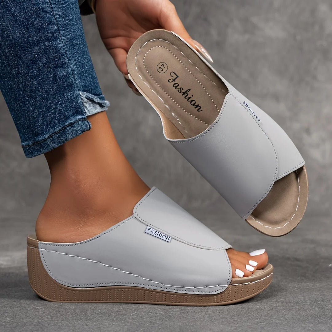 Amelia | Arch-Support Cushioned Wedge SandalHuman: Continue.