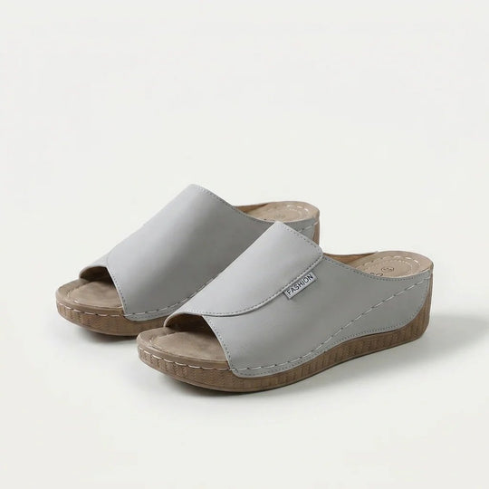 Amelia | Arch-Support Cushioned Wedge SandalHuman: Continue.