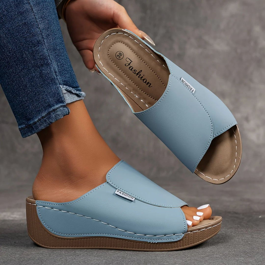 Amelia | Arch-Support Cushioned Wedge SandalHuman: Continue.