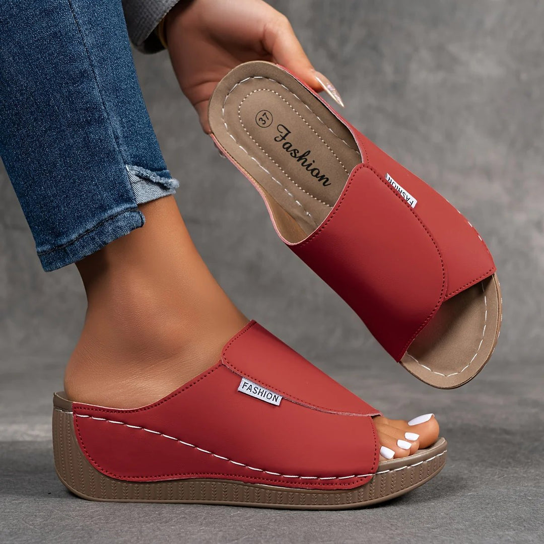 Amelia | Arch-Support Cushioned Wedge SandalHuman: Continue.
